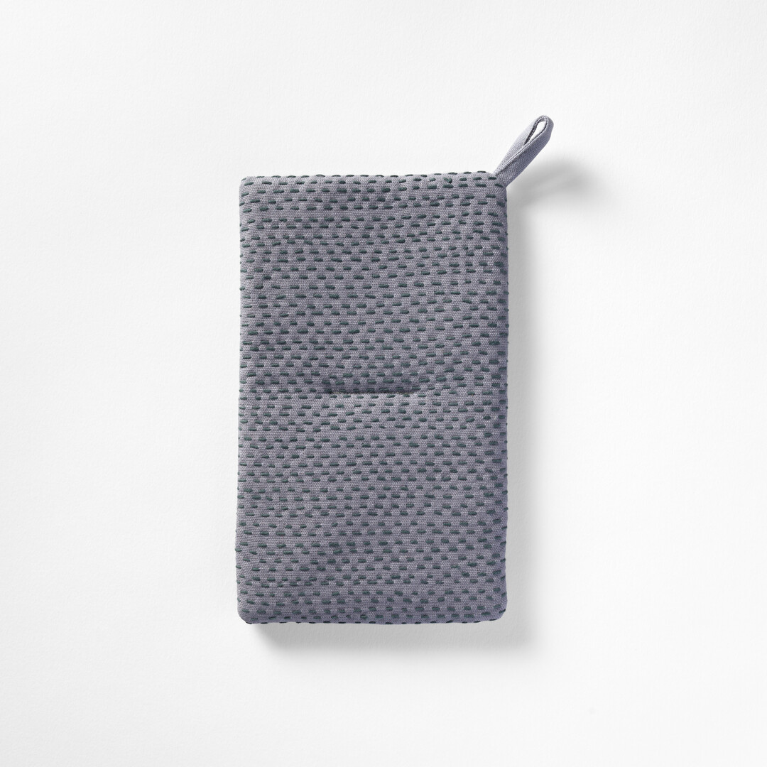 A rectangular sashiko pot holder in grey by Teras from Japan House London