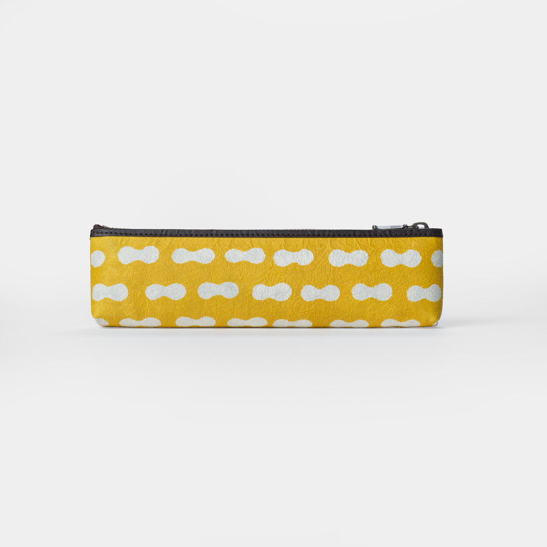 Stencil dyed yellow pencil case by Keijusha from Japan House London.