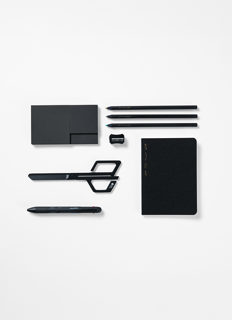 A selection of stationery in black in a rectangular formation from Japan House London.