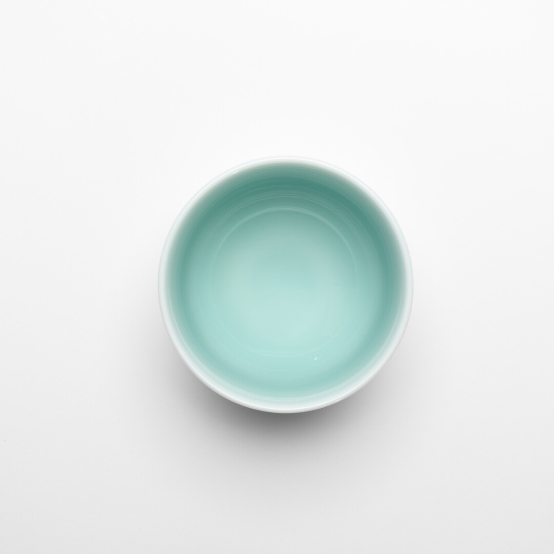 Nabeshima Celadon tea cup in a light turquoise from Japan House London.