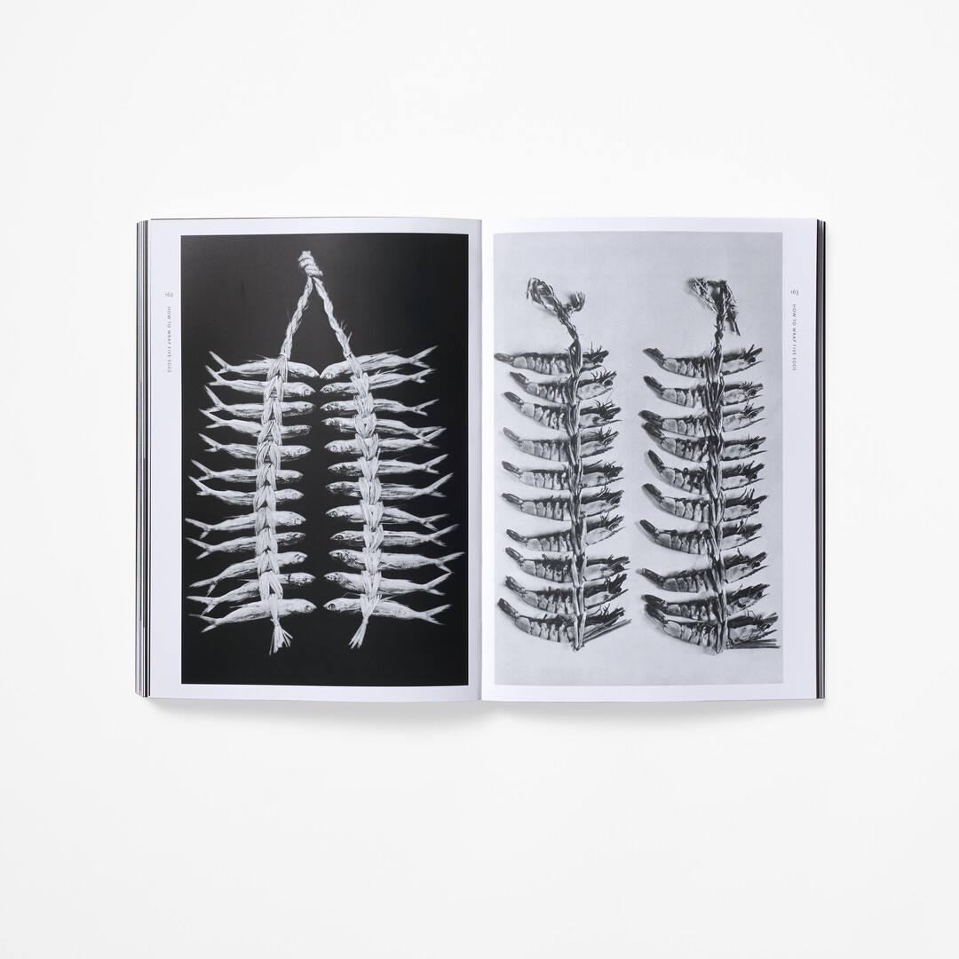 A spread with black and white photographs from the book How to Wrap Five Eggs from Japan House London.