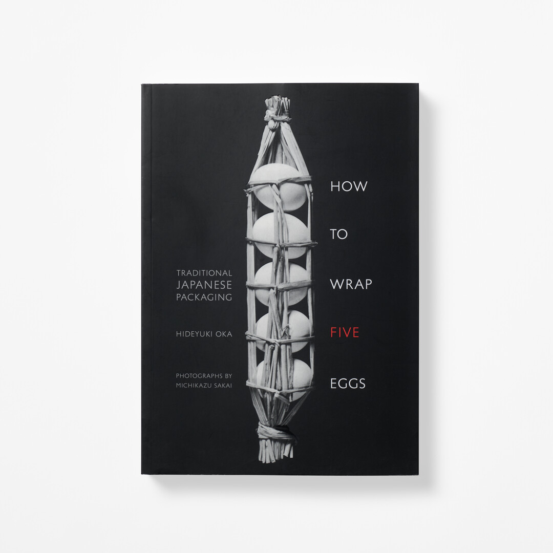 A black and white cover of the book How to Wrap Five Eggs from Japan House London.