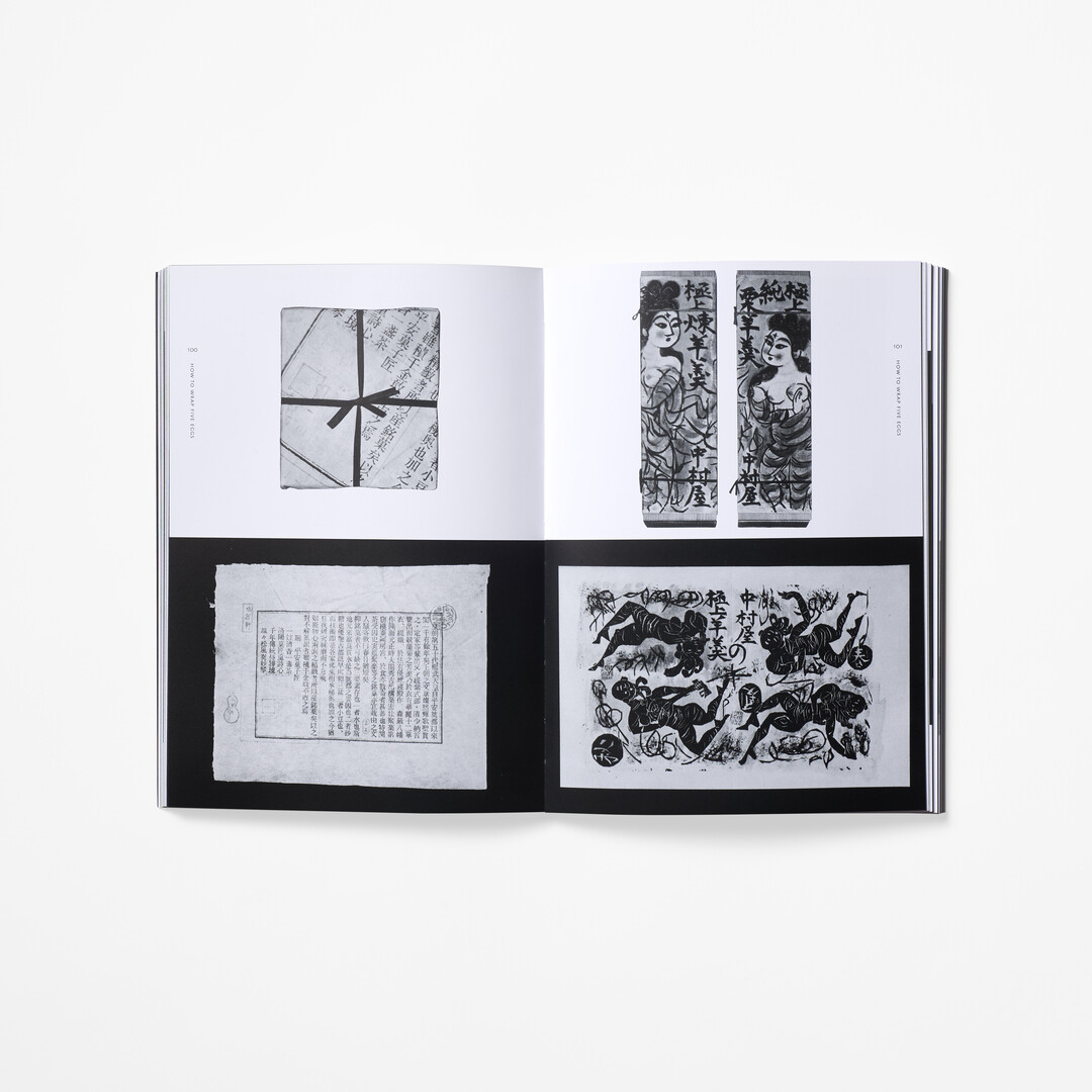 A spread with black and white photographs from the book How to Wrap Five Eggs from Japan House London.