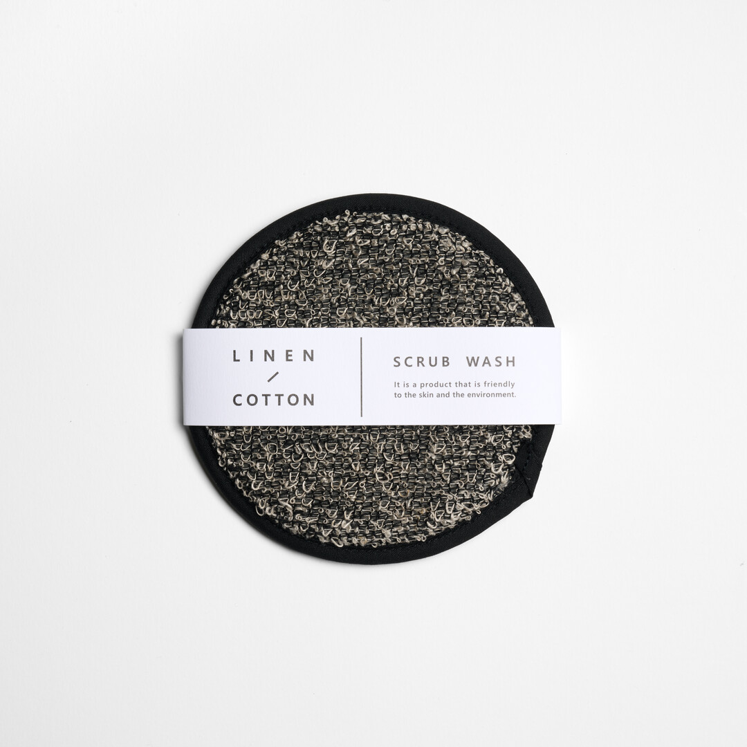 A grey, circular cotton linen blend scrub wash by Kiyoi, from Japan House London.