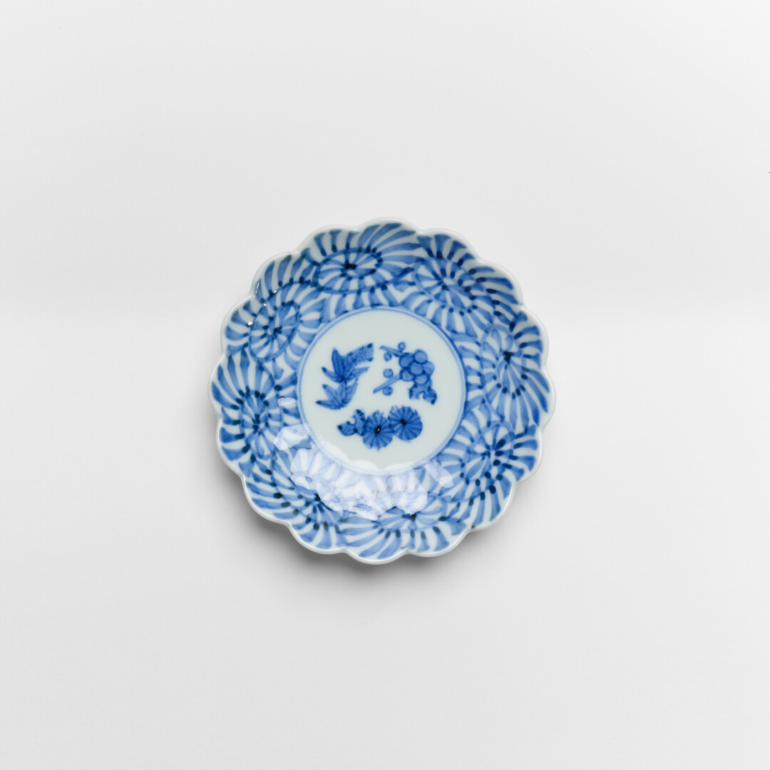 An Arita porcelain plate with indigo pattern of arabesque by Keizangama from Japan House London.