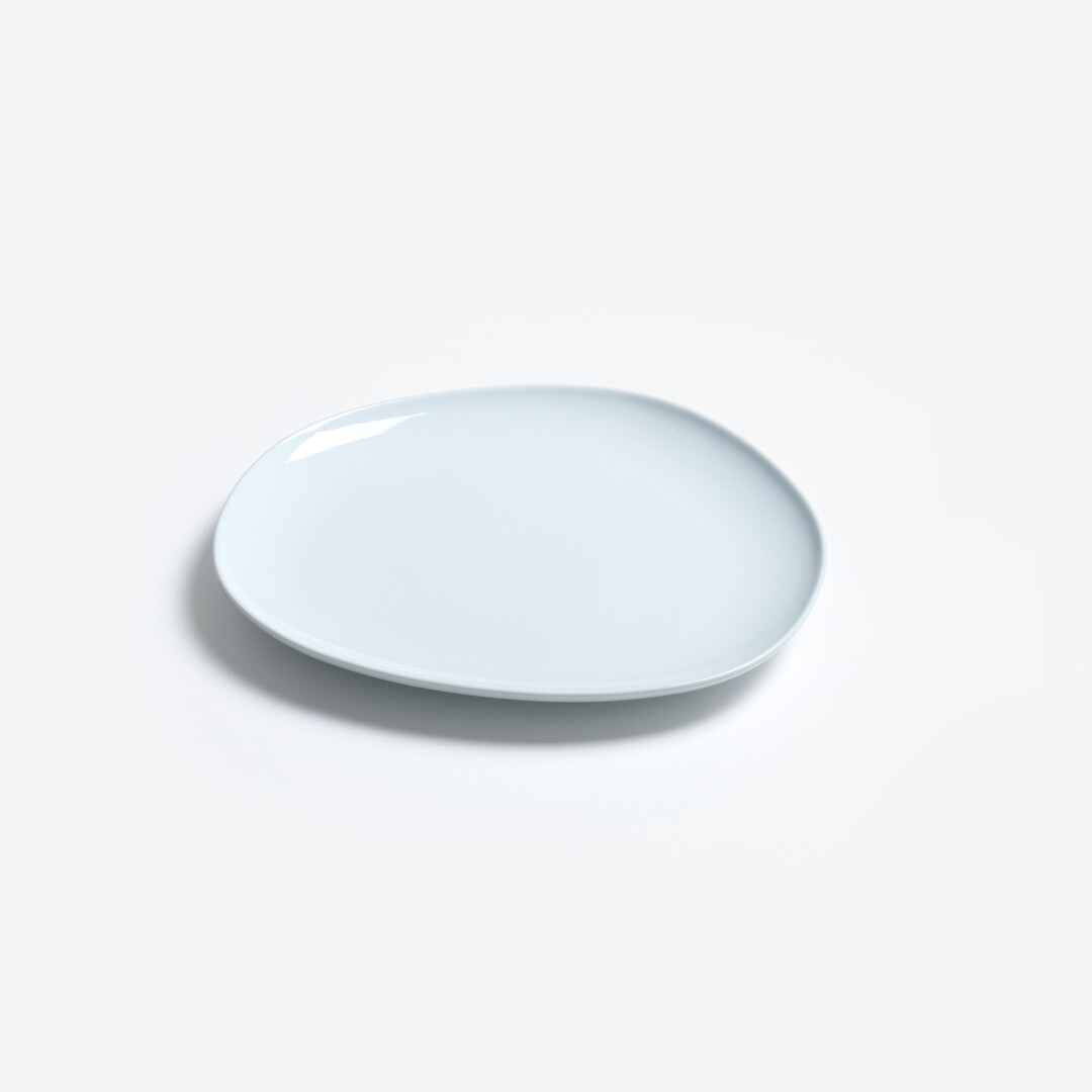 Large white Porcelain plate from series Petra by Hakusan from Japan House London.