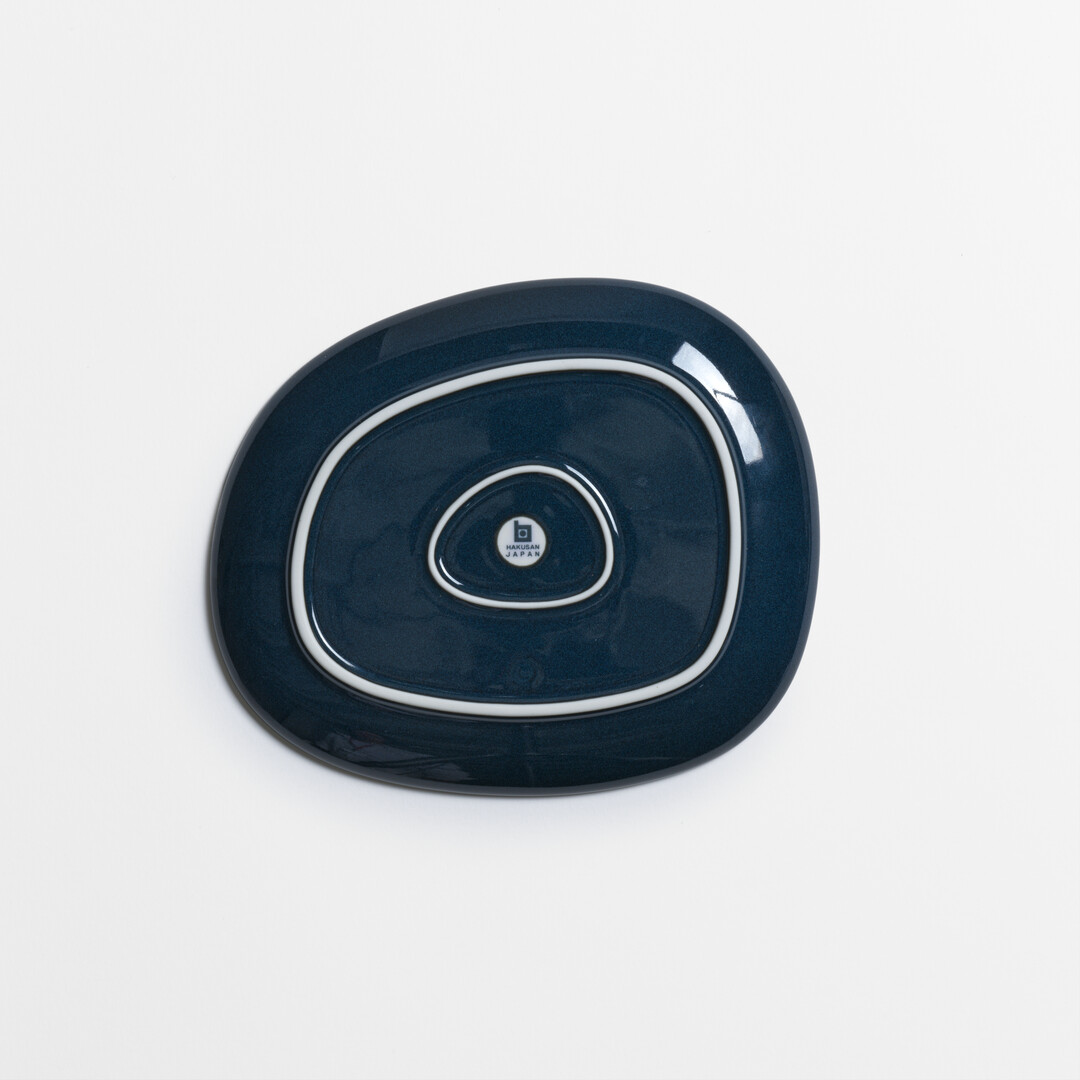 Medium Navy Porcelain plate from series Petra by Hakusan from Japan House London.