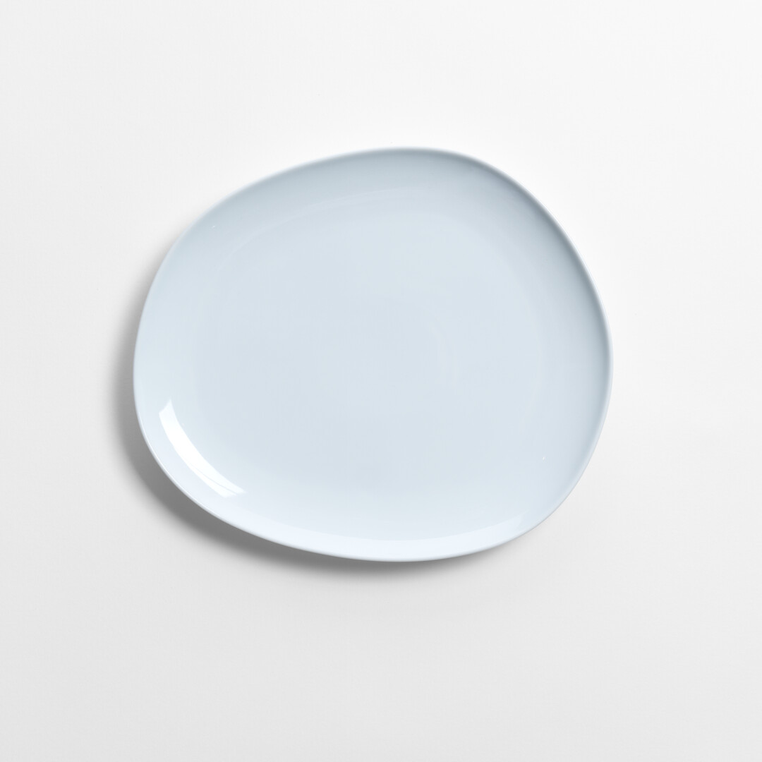 Large white Porcelain plate from series Petra by Hakusan from Japan House London.
