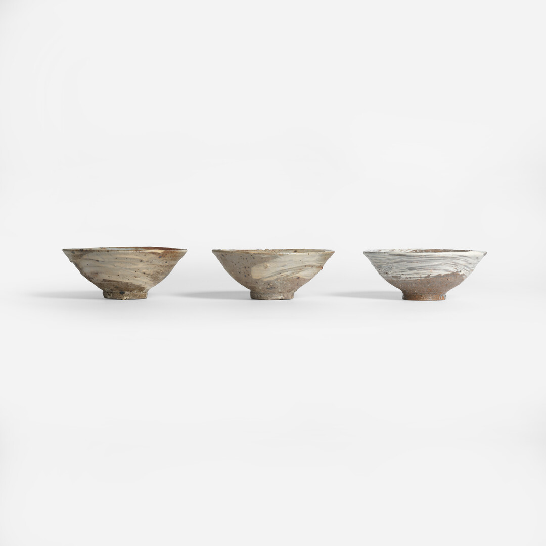 Three Tatsumi Koishiwara Ceramic Bowl - Hakeme Brushed Slip in a row from Japan House London.