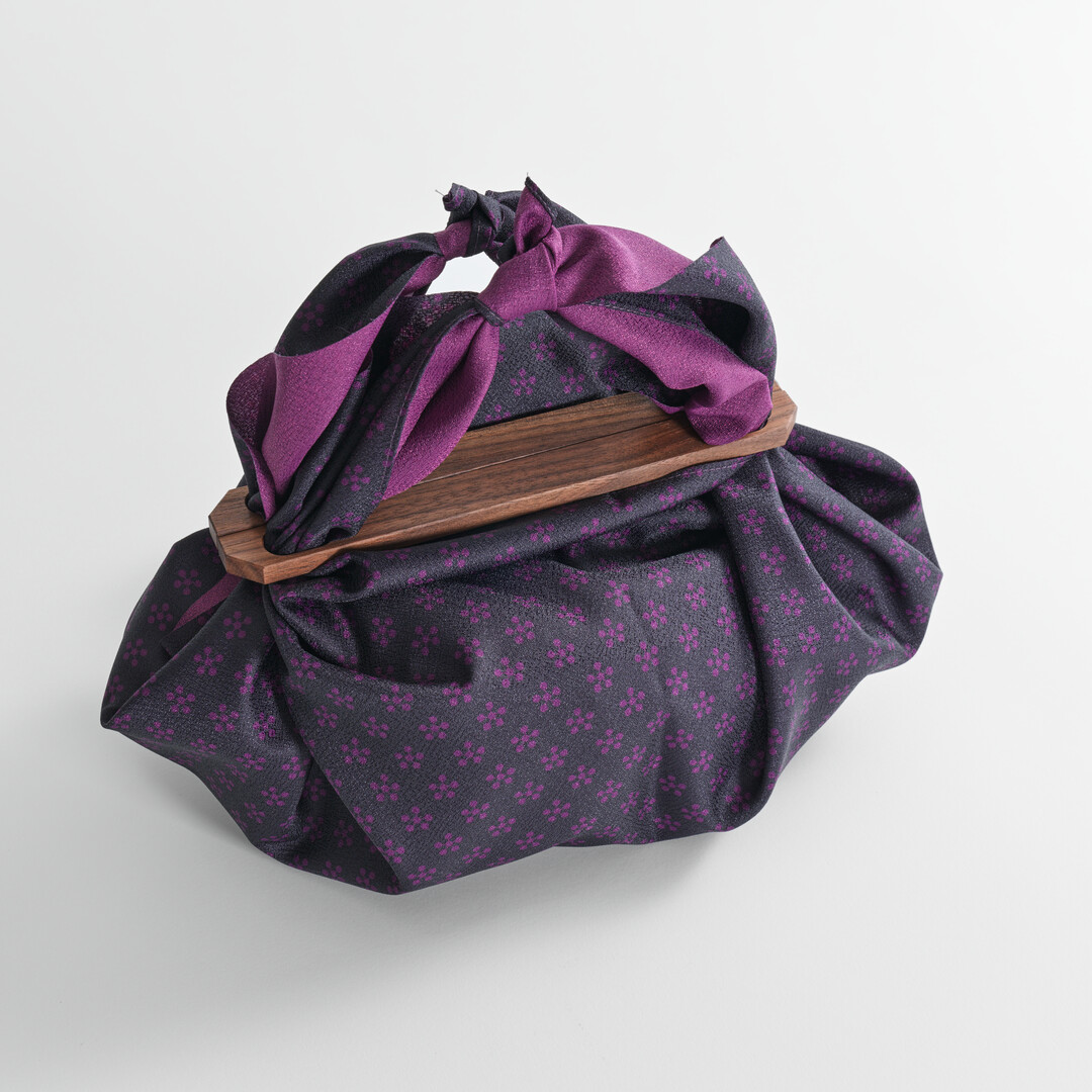 Black Walnut Furoshiki Handle with purple furoshiki from Japan House London.