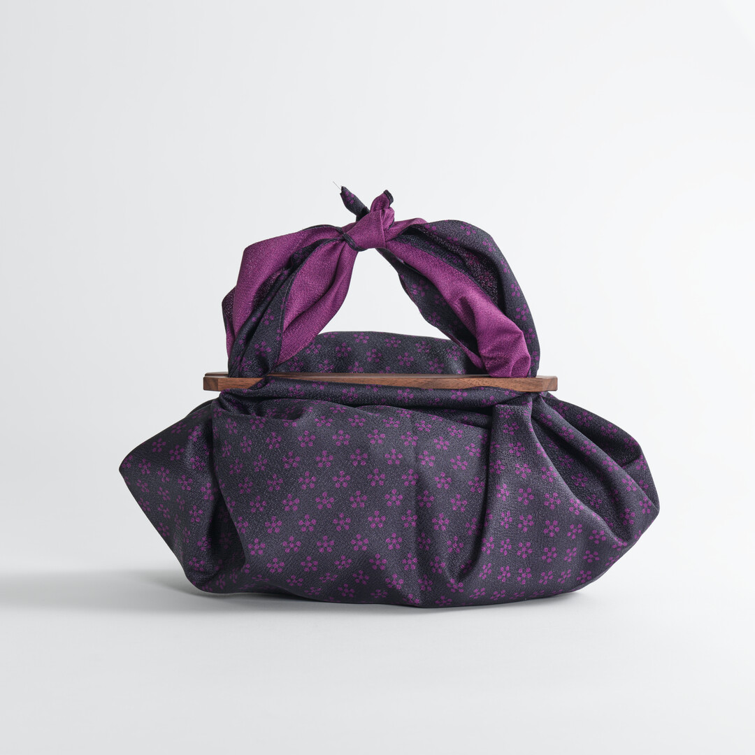 Black Walnut Furoshiki Handle with purple furoshiki from Japan House London.